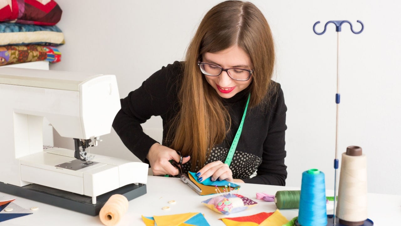 needlework and hand quilting in the workshop of a young tailor