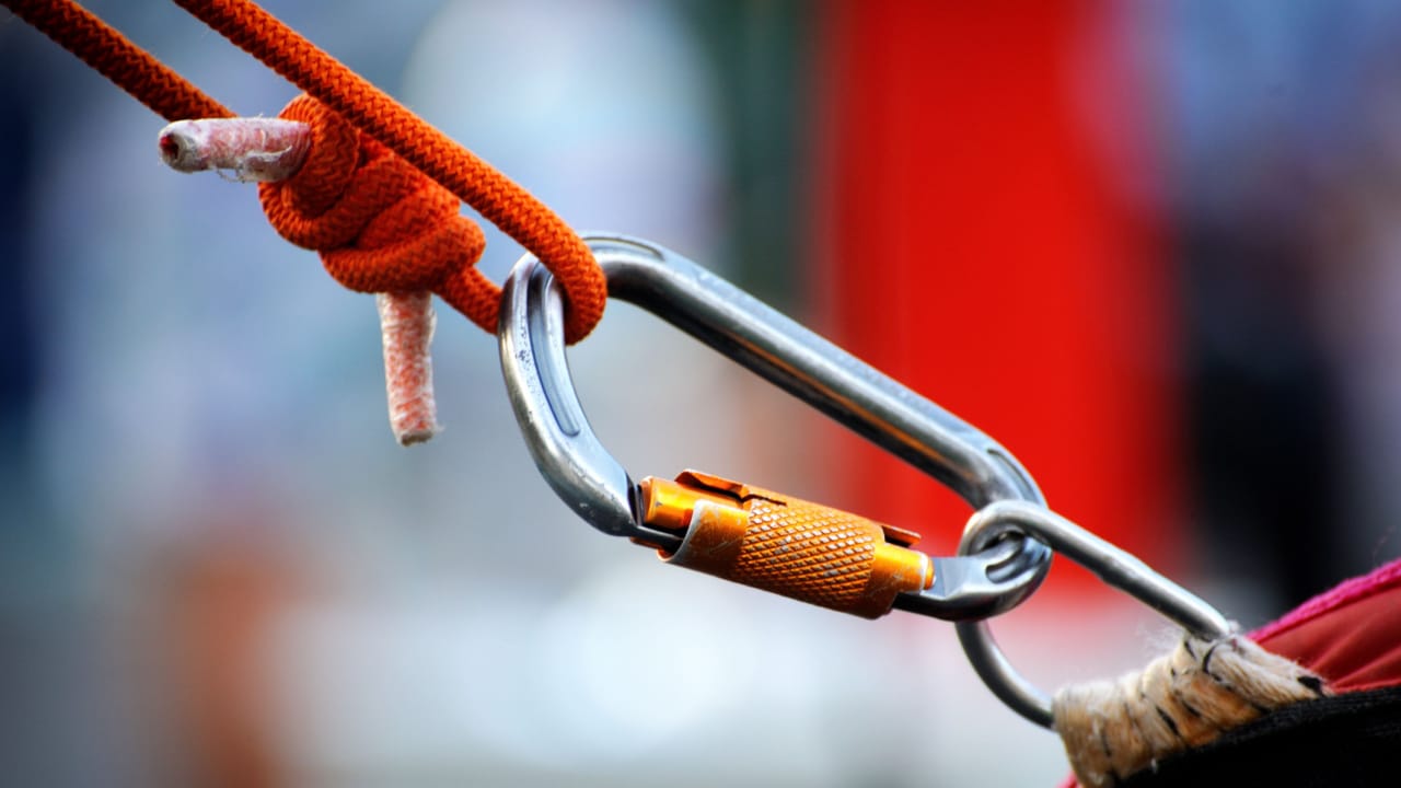 Person using rock climbing equipment